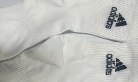 Khởi tố chủ cơ sở sản xuất 200.000 đôi tất giả nhãn hiệu Nike, Adidas, Uniqlo
